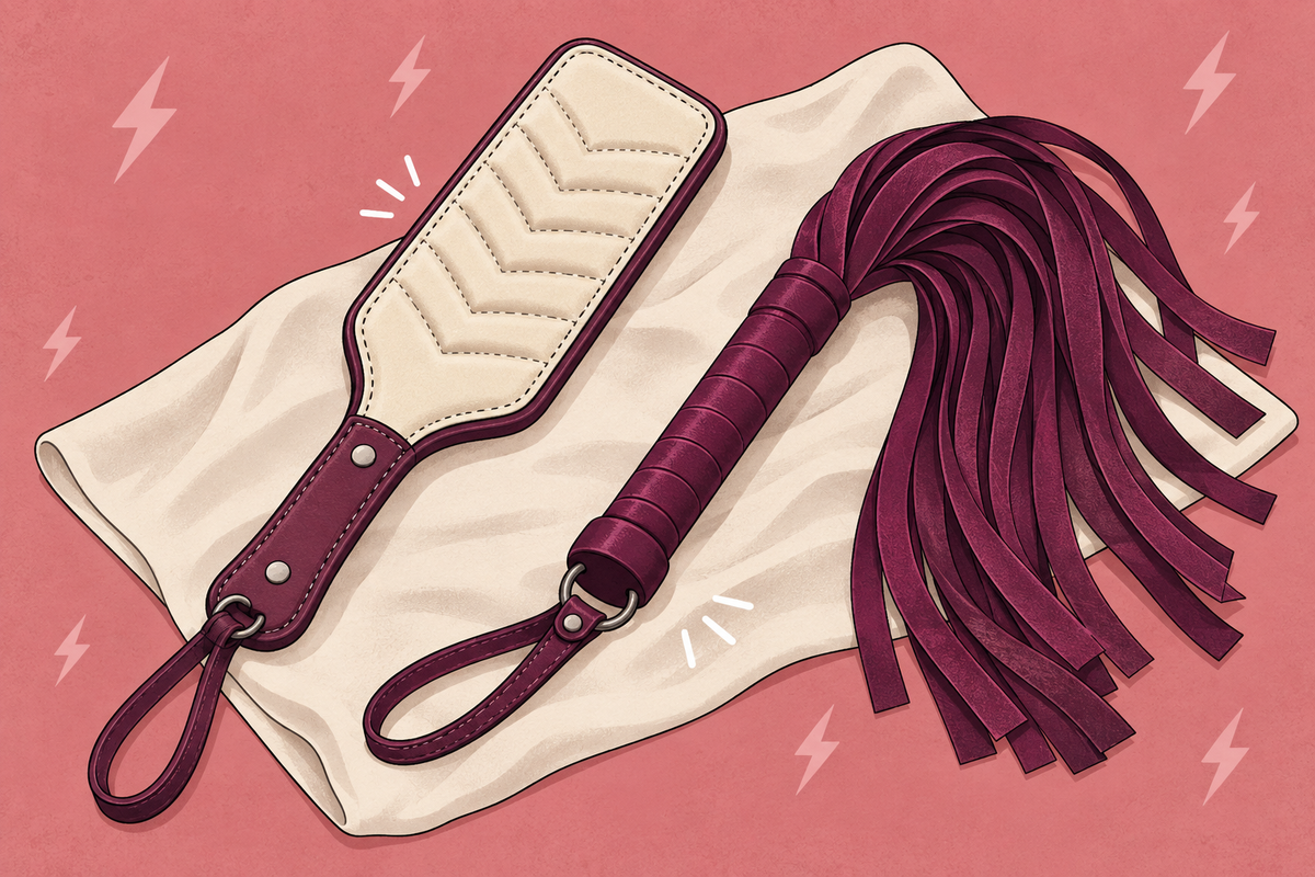 Illustration of a padded paddle and flogger on a folded towel.